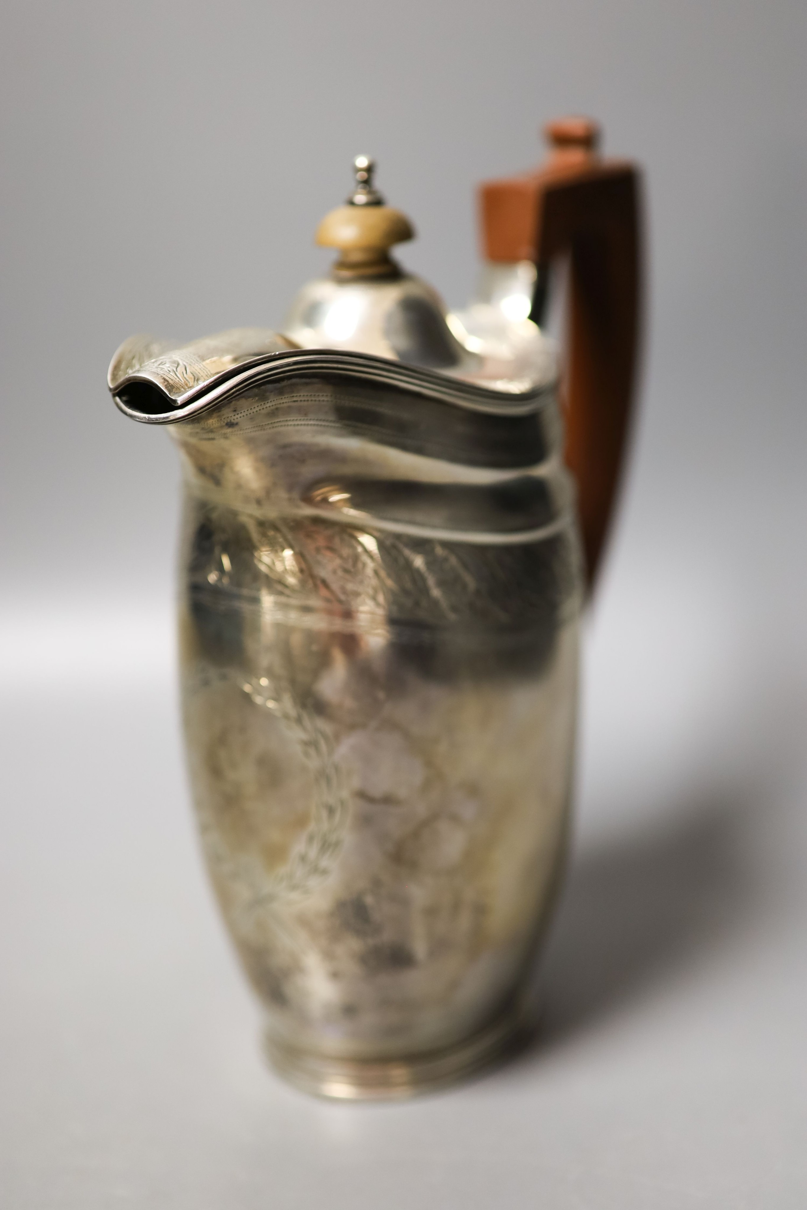 A George V three piece silver oval tea set, London, 1930, together with a similar George III silver cream jug, London, 1800